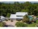 Stunning aerial view highlights a home with a private pool, mature palm trees, and a spacious backyard at 15733 Tower View Dr, Clermont, FL 34711