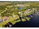 Picturesque aerial view of waterfront homes, offering boat docks and beautiful water access at 15733 Tower View Dr, Clermont, FL 34711