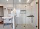 Elegant bathroom featuring a glass shower, vintage style faucet, and classic tile flooring at 15733 Tower View Dr, Clermont, FL 34711
