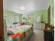 Colorful bedroom with two beds, bright walls, and coordinated decor creating a cheerful space at 15733 Tower View Dr, Clermont, FL 34711