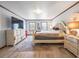 Bedroom with light walls, two windows, and a queen-sized bed at 15733 Tower View Dr, Clermont, FL 34711