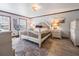 Bedroom with light walls, two windows, and a queen-sized bed at 15733 Tower View Dr, Clermont, FL 34711