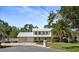 Charming two-story home with a well-manicured front yard, a fountain, and a two-car garage at 15733 Tower View Dr, Clermont, FL 34711