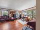 Bright living room featuring hardwood floors, recessed lighting, and large windows at 15733 Tower View Dr, Clermont, FL 34711
