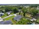 An aerial view showing the house with its screened in porch, a storage shed, and a privacy fence at 15828 Se 98Th Ter, Summerfield, FL 34491
