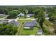 An aerial view of the home featuring the backyard, privacy fence, shed, landscaping and neighborhood at 15828 Se 98Th Ter, Summerfield, FL 34491