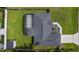 An aerial view shows the home, backyard, and screened patio at 15828 Se 98Th Ter, Summerfield, FL 34491