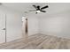 The bedroom has attractive wood-look flooring and ensuite bath at 15828 Se 98Th Ter, Summerfield, FL 34491