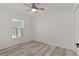 Light bedroom offers a ceiling fan and view to the outside at 15828 Se 98Th Ter, Summerfield, FL 34491