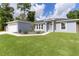 Inviting single-story home with well-maintained lawn and landscaping at 15828 Se 98Th Ter, Summerfield, FL 34491