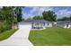 Desirable single-story home with a large front yard and a two-car garage at 15828 Se 98Th Ter, Summerfield, FL 34491