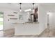 Bright kitchen featuring granite countertops, stainless steel appliances, and open shelving at 15828 Se 98Th Ter, Summerfield, FL 34491