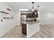 Modern kitchen featuring granite counters, stainless appliances, and open layout to the living space at 15828 Se 98Th Ter, Summerfield, FL 34491