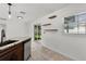 Open kitchen showcasing granite counters, stainless appliances, and backyard views at 15828 Se 98Th Ter, Summerfield, FL 34491
