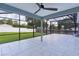 Tiled patio offers a great outdoor space with screened enclosure and ceiling fan at 15828 Se 98Th Ter, Summerfield, FL 34491