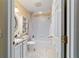 Well-maintained bathroom with a vanity, toilet, and shower/tub combo with curtain at 16730 Se 78Th Lillywood Ct, The Villages, FL 32162