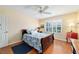 Bedroom featuring hardwood floors, neutral walls, and shutters on the window at 16730 Se 78Th Lillywood Ct, The Villages, FL 32162
