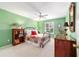 Bright bedroom showcasing ample natural light, a ceiling fan, and a comfortable bed at 16730 Se 78Th Lillywood Ct, The Villages, FL 32162