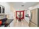 Eat-in kitchen with stainless steel appliances, white cabinetry, and a charming breakfast nook at 16730 Se 78Th Lillywood Ct, The Villages, FL 32162