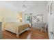 Bright bedroom with a high ceiling, dresser, and ample natural light at 1762 Meadowlark Ave, The Villages, FL 32162