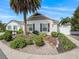 A single-story home with a well-manicured lawn at 1762 Meadowlark Ave, The Villages, FL 32162