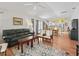 Bright and airy living room open to the dining area and kitchen, perfect for entertaining at 1762 Meadowlark Ave, The Villages, FL 32162
