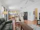 Open floor plan with living room seamlessly connected to the dining and kitchen areas at 1762 Meadowlark Ave, The Villages, FL 32162