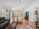 Open-concept layout with spacious living room flowing into the kitchen and dining areas at 1762 Meadowlark Ave, The Villages, FL 32162