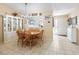 Bright dining area featuring tile flooring and seamless flow into the living spaces, perfect for entertaining at 17860 Se 89Th Natchez Ave, The Villages, FL 32162