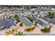 Wide aerial shot of a lovely home nestled in a vibrant community with pristine golf course and numerous well-kept residences at 2101 Southern Star Way, The Villages, FL 32162