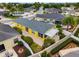 Backyard aerial view highlighting a covered patio, lush landscaping, and a private backyard perfect for relaxing and entertaining guests at 2101 Southern Star Way, The Villages, FL 32162
