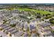 A scenic aerial shot showcasing the community, ponds, a golf course, and well-maintained landscaping at 2101 Southern Star Way, The Villages, FL 32162