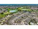 Panoramic aerial shot of the community, golf course, and lake, emphasizing its peaceful and recreational setting at 2101 Southern Star Way, The Villages, FL 32162