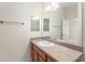 Bathroom showcasing a single sink vanity, large mirror, and towel bar at 2101 Southern Star Way, The Villages, FL 32162