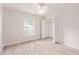 Bright, airy bedroom with vinyl plank floors, ceiling fan, and a closet at 2101 Southern Star Way, The Villages, FL 32162
