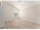 Bedroom with ceiling fan, wood flooring, and one window at 2101 Southern Star Way, The Villages, FL 32162