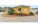 Charming home featuring a well-kept lawn, landscaping and walkway leading to the front door at 2101 Southern Star Way, The Villages, FL 32162