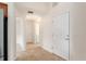 Tiled foyer with a front door and views of other rooms including the laundry room at 2101 Southern Star Way, The Villages, FL 32162