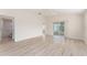 Spacious main bedroom area with tile floors, en suite bath, and views of the backyard at 2101 Southern Star Way, The Villages, FL 32162
