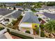 Aerial view of home featuring a covered back patio, and beautiful landscaping with various plants at 2101 Southern Star Way, The Villages, FL 32162