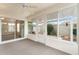 Bright sunroom offers view of fenced yard, with a door to the outside at 2101 Southern Star Way, The Villages, FL 32162