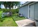 Outdoor patio with artificial turf, seating, and lush green surroundings, creating a cozy relaxation spot at 2110 Churchill Downs Cir, Orlando, FL 32825