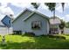 This fenced backyard features a covered patio, offering a comfortable outdoor living space at 2110 Churchill Downs Cir, Orlando, FL 32825