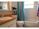 Well-lit bathroom with a vanity, toilet, and a shower-tub combination at 2110 Churchill Downs Cir, Orlando, FL 32825