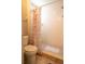 Bathroom with a tiled shower and modern toilet at 2110 Churchill Downs Cir, Orlando, FL 32825