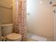 Bathroom with a tiled shower and modern toilet at 2110 Churchill Downs Cir, Orlando, FL 32825
