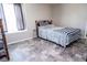 Well-lit bedroom with a patterned rug and comfortable seating at 2110 Churchill Downs Cir, Orlando, FL 32825