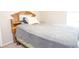 Bedroom featuring a comfortable sleeping space with natural light and a vintage wooden headboard at 2110 Churchill Downs Cir, Orlando, FL 32825