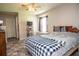 Inviting bedroom with a ceiling fan, window, and closet at 2110 Churchill Downs Cir, Orlando, FL 32825