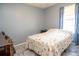Cozy bedroom with soft, neutral walls and a comfortable bed at 2110 Churchill Downs Cir, Orlando, FL 32825